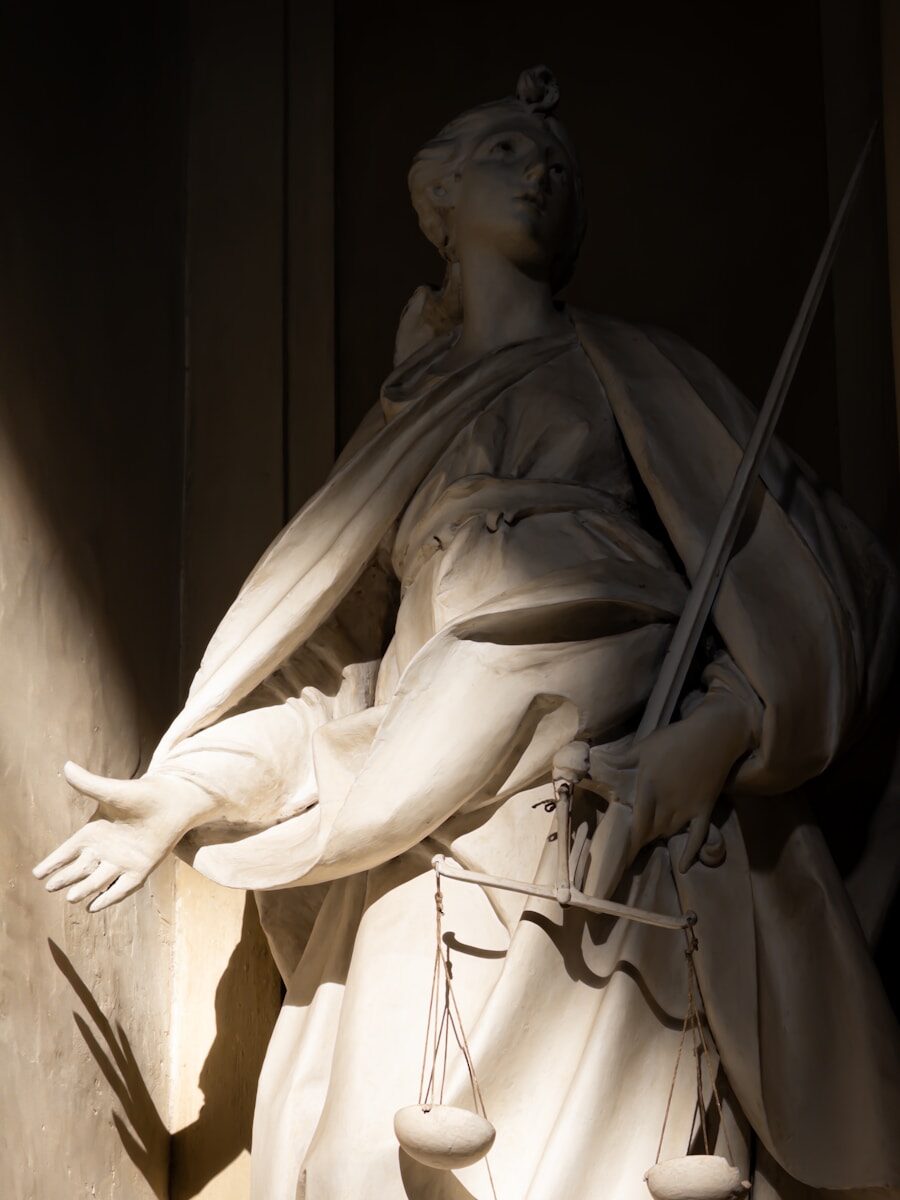 Statue of justice holding scales and sword.