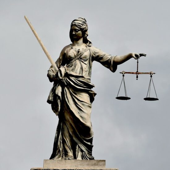 A statue of lady justice holding a sword and a scale
